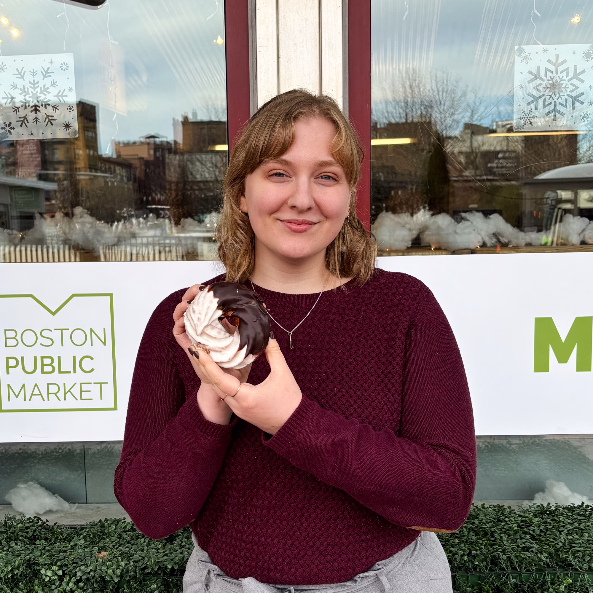 Amy Gilbert headshot holding donut